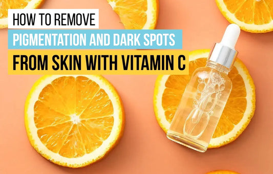 Vitamin C serum bottle with sliced oranges on peach background – concept of natural skincare for removing pigmentation and dark spots
