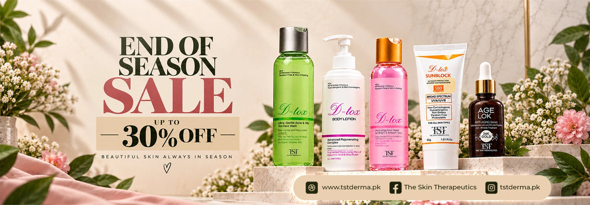 A promotional banner for a skincare end-of-season sale, featuring five skincare products from The Skin Therapeutics (TSK) lined up on a decorative beige platform with floral arrangements. The products include a green bottle, a white pump bottle, a pink bottle, a white tube, and a brown bottle.